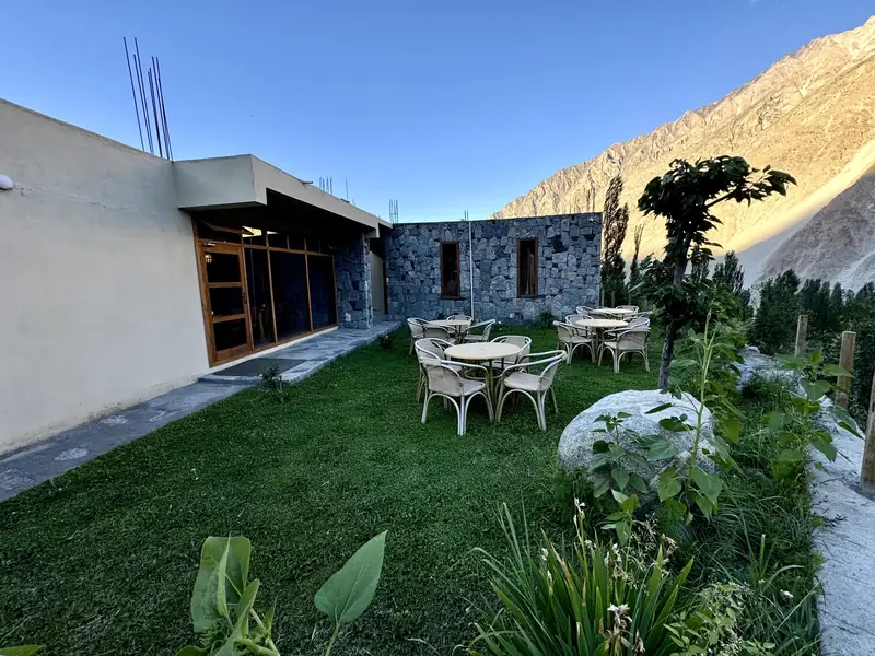 Lawn tables in evening light
